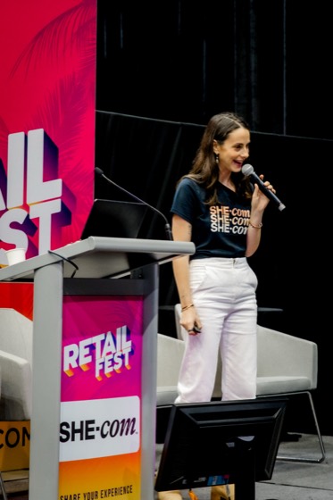 Gabi at the podium at Retail Fest 2026